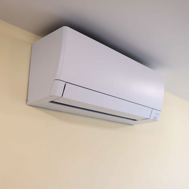 Wall-mounted air conditioning unit indoors.